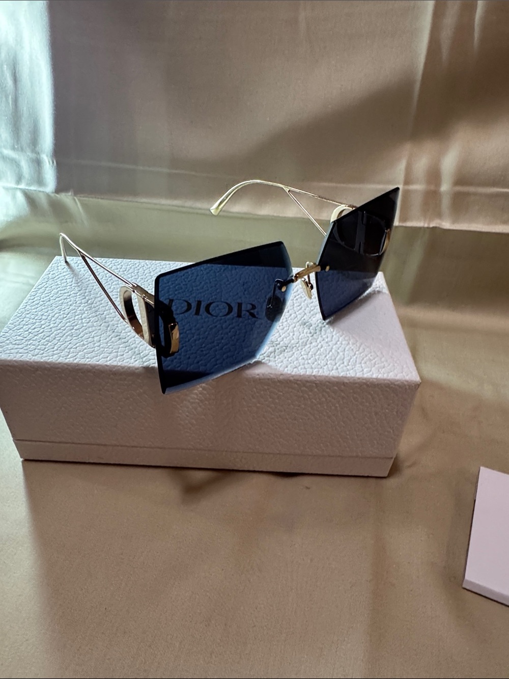 Dior Women's Rimless Sunglasses with Dark Blue Lenses and Gold Temples